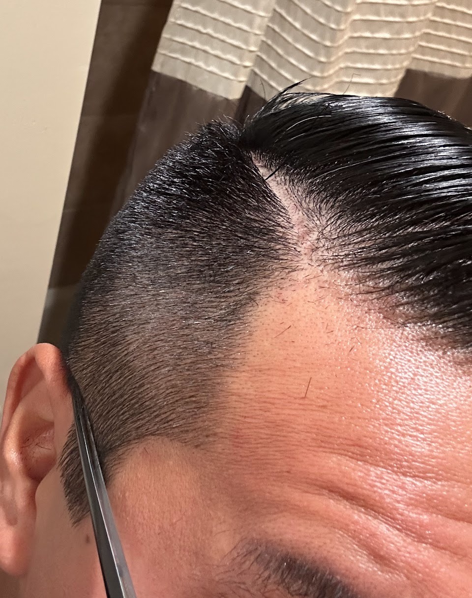 A finished side part with a tapered fade